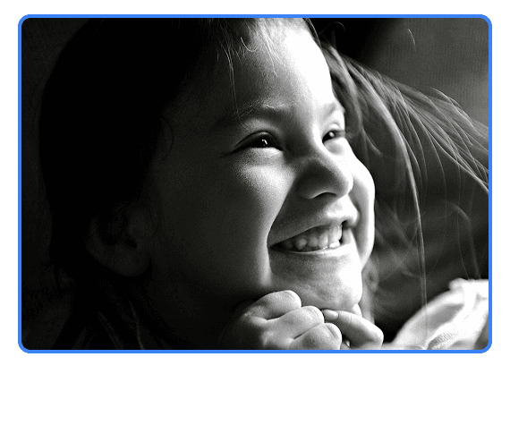 A child smiling — representing joy, dignity, and compassionate care